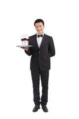 A Asian waiter holding tray of champagne