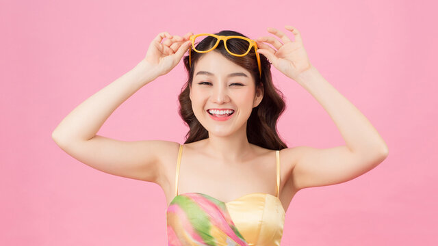 Portrait of a beautiful young asian girl in sunglasses