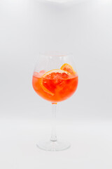 Yellow alcoholic cocktail on white background
