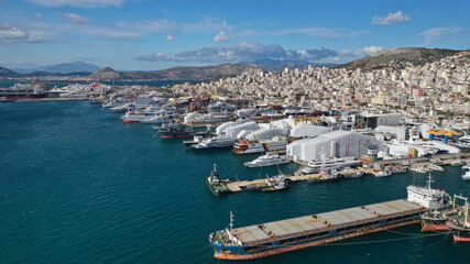 Fototapeta na wymiar Aerial drone photo of industrial shipyards and ship repairs in Perama area next to island of Salamina, Attica, Greece