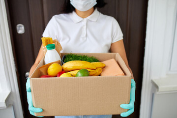 Courier with packing box with food, contactless delivery