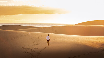 Obraz premium Young man walking in the runes in Gran Canaria in Spain during Covid