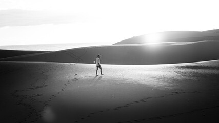 Young man walking in the runes in Gran Canaria in Spain during Covid