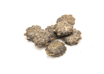 Pile of gac seeds (momordica cochinchinensis) isolated on white background