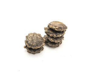 Pile of gac seeds (momordica cochinchinensis) isolated on white background