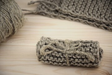 Ecofriendly jute washcloth, natural zero waste handmade household accessories, twine  on natural wooden background