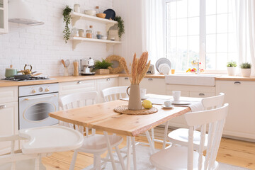 cute cozy light interior design of the apartment with a free layout of the kitchen and bedroom areas. a lot of windows, a wooden floor and a hanging swing.