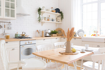 cute cozy light interior design of the apartment with a free layout of the kitchen and bedroom areas. a lot of windows, a wooden floor and a hanging swing.