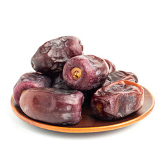 Dried organic date fruits in a plate, isolated on white background