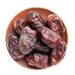 Dried organic date fruits in a plate, top view, isolated on white background