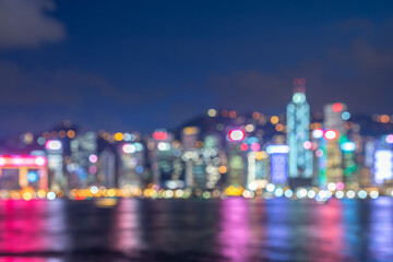 Blurred abstract background lights, beautiful cityscape view of Hong Kong city skyline at night in Hong Kong.
