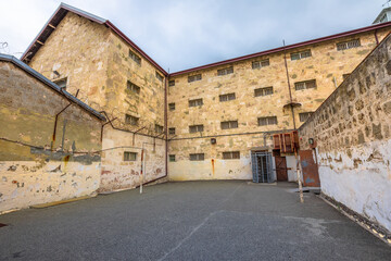 courtyard with barbed wire of Fremantle Prison historic building, UNESCO World Heritage and one of...