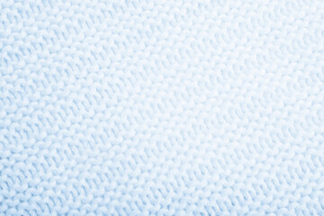 Close up of blue knitted textured background. Trendy color.