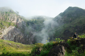 Man meditates at mount Batur