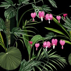 Seamless background from a flowers ornament and exotic tropical leaves, fashionable modern wallpaper or textile. Illustration "bleeding heart" (Dicentra spectabilis) on blak background.