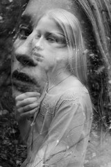 Black and white double exposure of young woman 