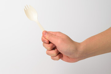 Plastic spork on white background