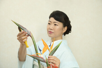Japanese woman who does flower arrangement (Ikebana)