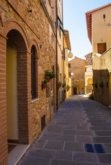 A quiet residential street in the historic medieval village of Batignano, Grosseto Province, Tuscany, Italy
