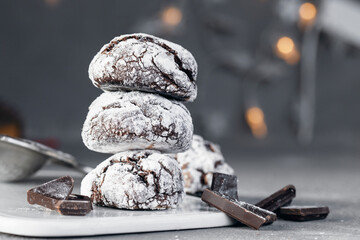 Home baked chocolate crinkle cookies in icing sugar. Cracked chocolate biscuits .