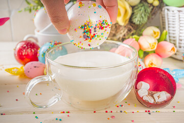 Festive Easter hot chocolate bomb. White chocolate bomb for hot cocoa drink, with marshmallow and...
