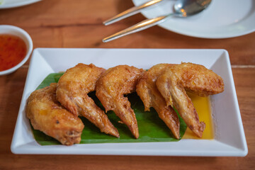 Fried chicken wings on plate.
