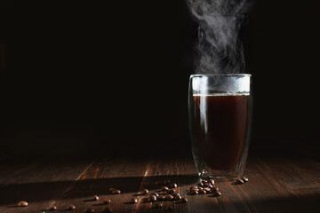 coffee with steam on a dark background