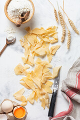 Homemade and freshly made pasta Maltagliati. Traditional italian food. Cooking concept. Top view.