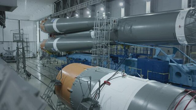 Construction of the Soyuz 2 space rocket. A spaceship in a military hangar. Prepares space rocket for launch. Space technologies.