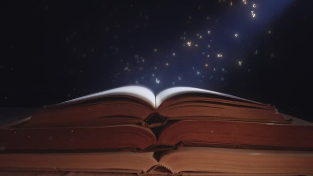 A ray of moon light falls on the open magic book with flying out letters.