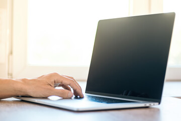 close up. male using a modern laptop.