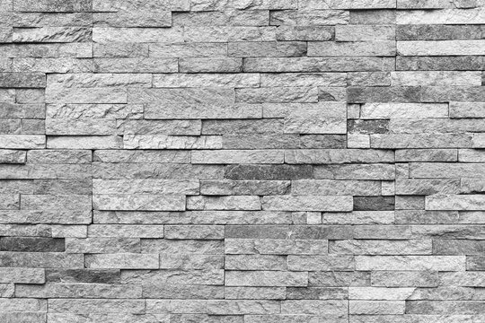 Natural facade stone decoration quartzite background texture. modern granite stone wall