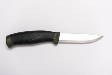 Fixed blade knife. Knife with rubber handle. Knife on a gray background.