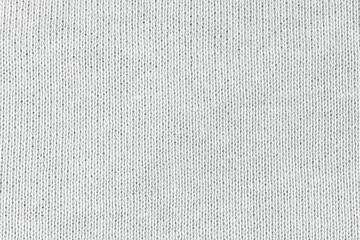 White natural texture of knitted wool textile material background. White cotton fabric woven canvas...