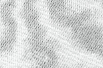 White natural texture of knitted wool textile material background. White cotton fabric woven canvas texture