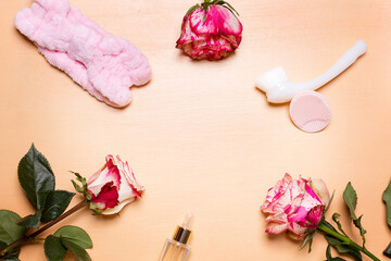 Arrangement of rose flowers and beauty tools and treatment