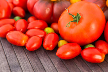 different varieties of ripe red and yellow appetizing tomatoes