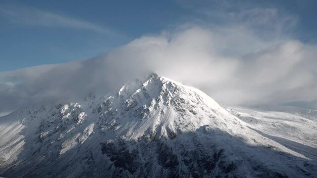 Aerial view of Pen yr Ole Wen mountain in Snowdonia National Park in Wales with snow