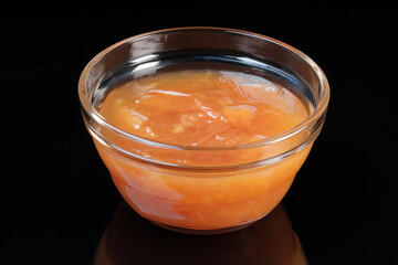 Glass bowl with peach jam