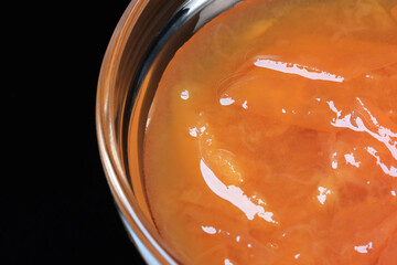 Glass bowl with peach jam
