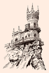 Medieval stone castle with towers and arches on a rocky cliff. © migfoto