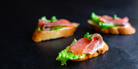 sandwich salmon fish bruschetta with seafood antipasto aperitif ready to eat on the table for healthy meal snack outdoor top view copy space for text food background image rustic diet pescetarian