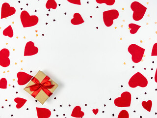 Gift and red hearts on a light background.Valentine's Day.