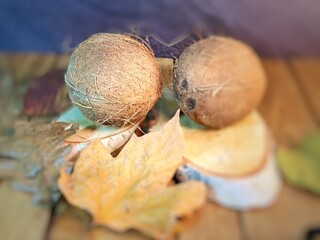 coconuts on wooden trays and on a wooden oak table