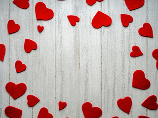 Red hearts on a gray wooden background, with space for text