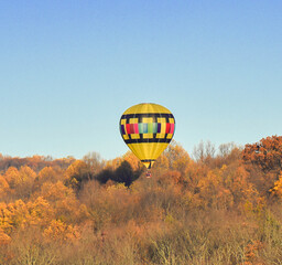 I captured this image one morning this past fall. You can see how the sky would change color as I took pictures from different angles, Hot air balloon floating free.