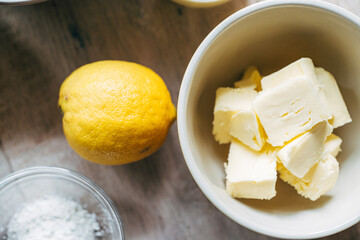 close up of lemon and butter on table