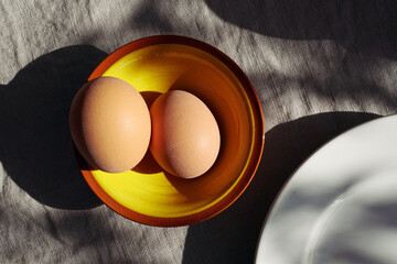 egg in a yellow bowl on table