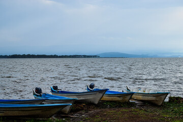 Fototapeta na wymiar Fishing boats at the shores of Lake Naivasha, Kenya