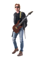 Obraz premium Cool attitude young handsome rock music guitarist with hands on back and electric guitar. Full body isolated on white background. 